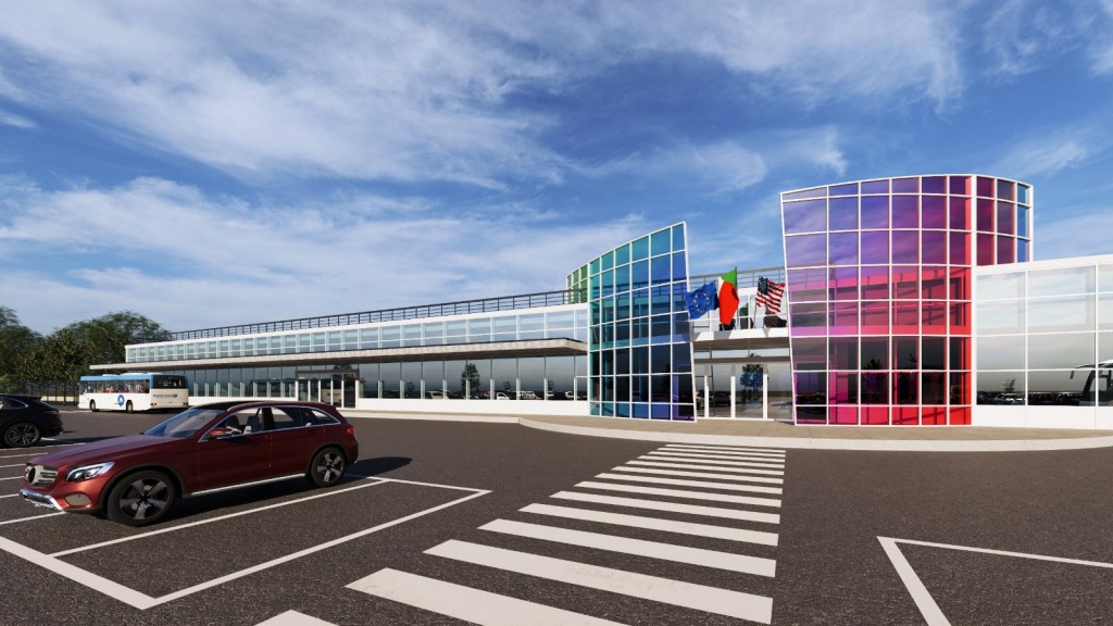 Rendering del progetto del terminal dell'aeroporto di Reggio Calabria con facciata vetrata colorata e parcheggio